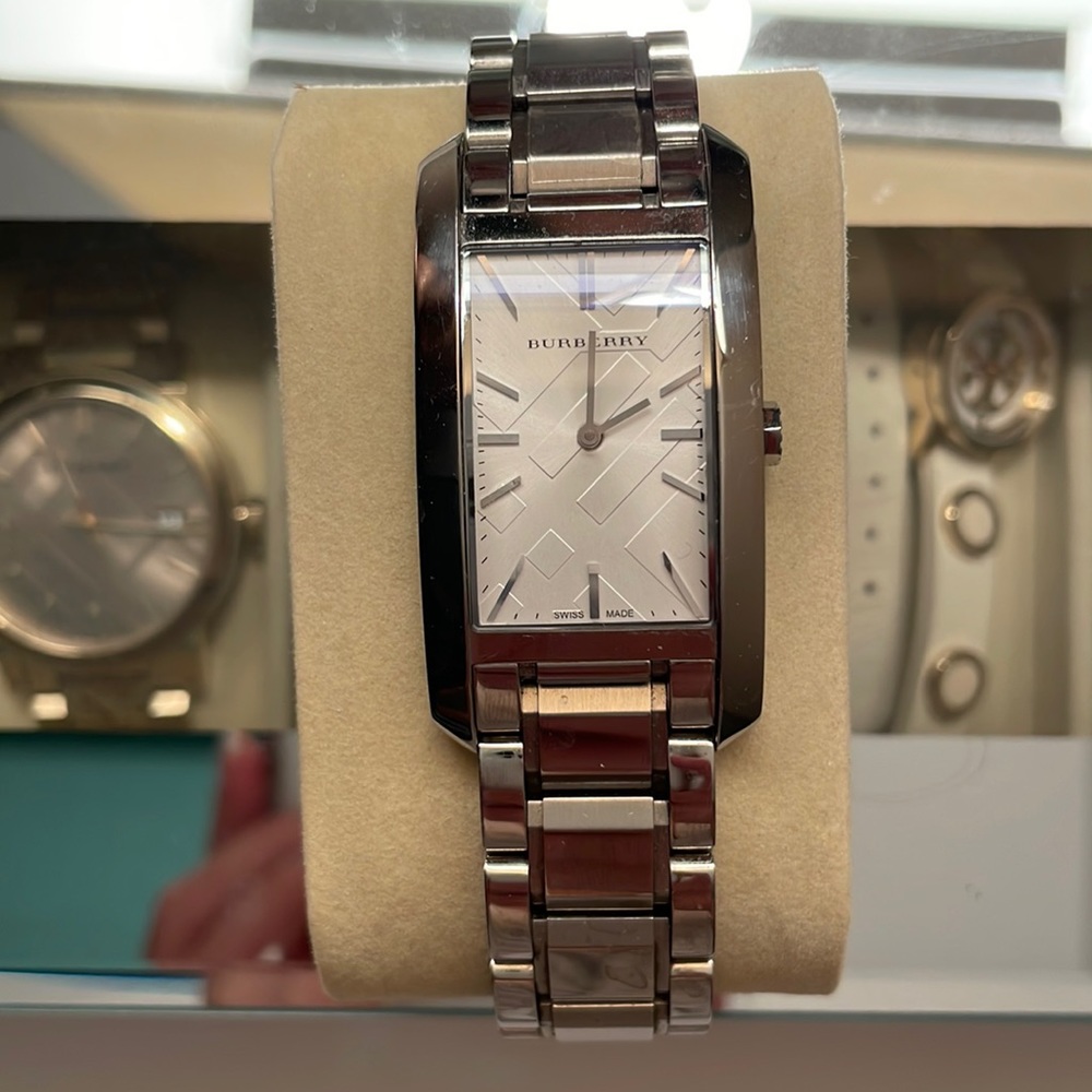 BURBERRY stainless steel watch with iconic Burberry logo plaid.